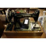 A cased table top Singer sewing machine