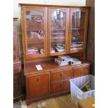 A reproduction side cabinet, with three glazed doors over two drawers and two cupboards, 136cm wide