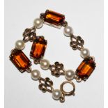 A pearl and citrine bracelet set in 9 carat gold