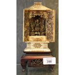 A 19th century Chinese carved ivory shrine, the twin doors enclosing three figures, the sides carved