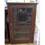 An Edwardian walnut side cabinet, with glazed door on bracket feet, 55cm wide