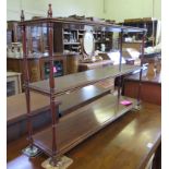 A Regency style mahogany three tier wall shelf, a two tier whatnot with two drawers, a leather lined