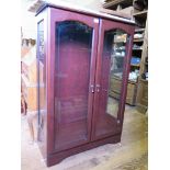 A laminate and glazed display cabinet with double doors and glazed sides, 83cm wide