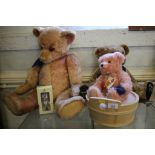 A pink Herman teddy in a timber tub, a Harrods commemorative teddy and two others