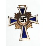 A German Nazi gilt and enamel Mothers Cross, dated on reverse 16th December 1938