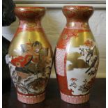 A pair of Japanese Kutani vases, depicting warriors and birds, 33cm high