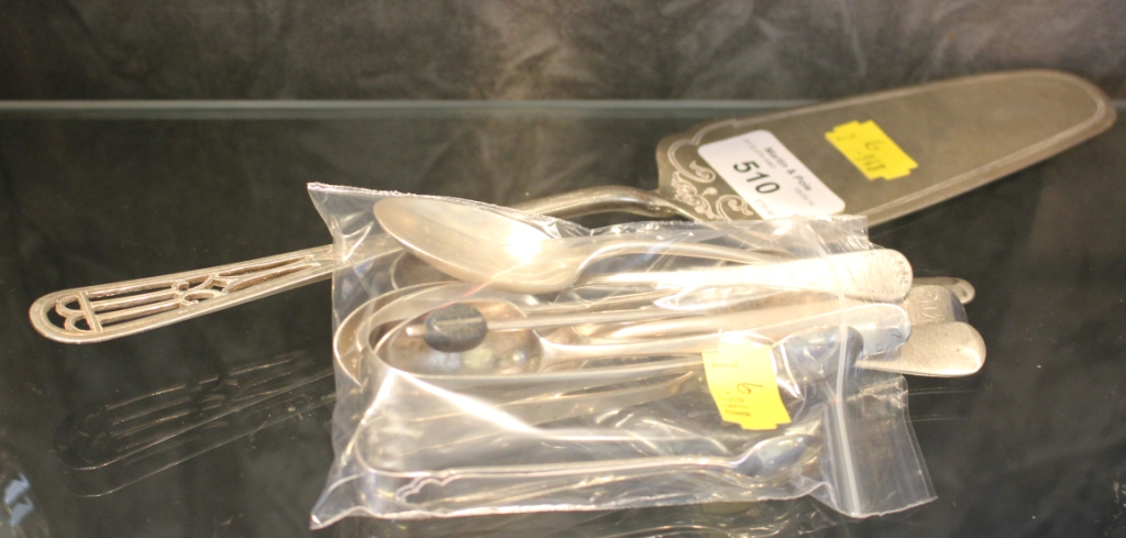 A small collection of spoons to include a silver cake slice
