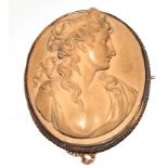 A finely carved lava cameo depicting head and shoulders of a lady