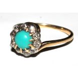 A turquoise and diamond cluster ring set in gold colour metal