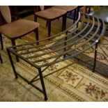 A wrought iron curved garden bench, 142cm wide