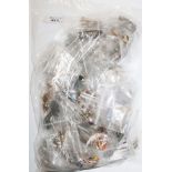 A large bag of costume jewellery brooches, mostly vintage