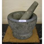 A stone pestle and mortar, of plain form, 19cm diameter