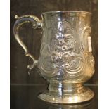 A George III silver tankard, later decorated in relief, Newcastle 1807