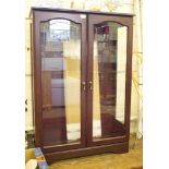A laminate and glazed display cabinet with double doors and glazed sides, 83cm wide