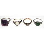A collection of four gem set rings