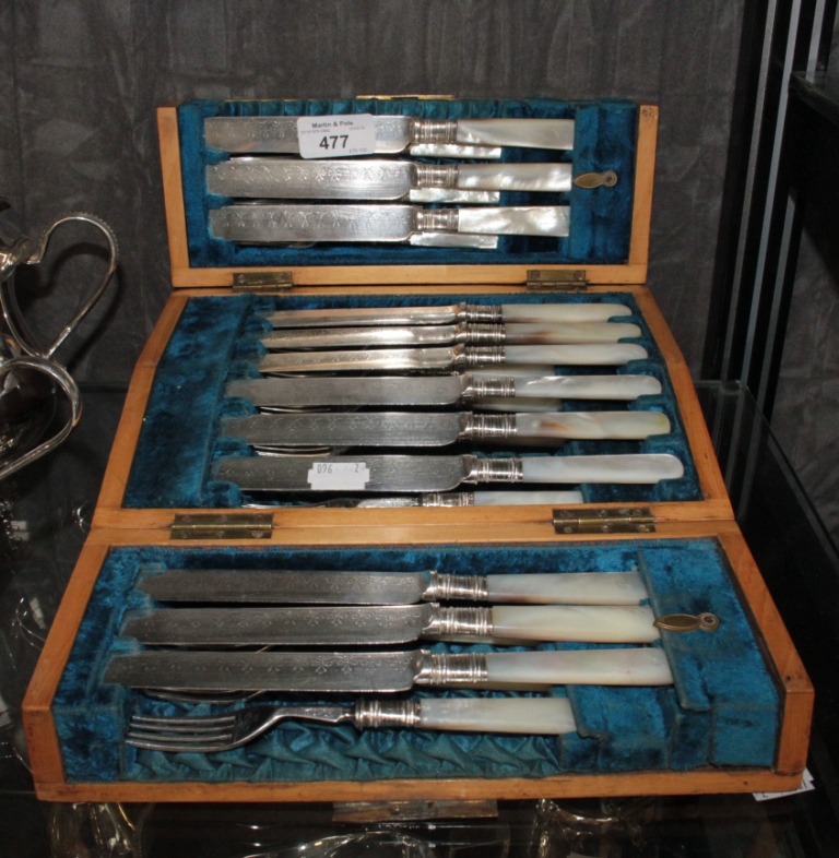 A cased set of knives and forks