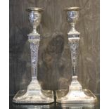A pair of Adam style silver candlesticks, Sheffield 1907