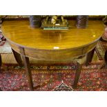 A George III mahogany demi lune side table, with reeded edge on square tapering legs, 112cm wide x