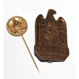A 1942 gilt NSRL achievement stick pin together with a German Rally NSDAP Parteitag 1933 badge