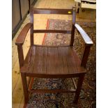 A pair of stained wood carver dining chairs with horizontal rails, solid seats and square section