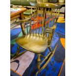 A stained wood rocking chair, in the shaker style, made by Stoe, Yugoslavia, on turned legs