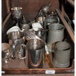 A small collection of pewter and silver plated tankards, a plated wine coaster, lustrewares, etc