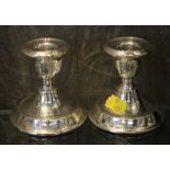 A pair of small silver candlesticks, London 1921