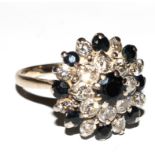 A diamond and sapphire cluster ring set in 18 carat gold
