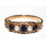 A five stone sapphire and pearl ring set in 9 carat gold