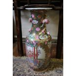 A Chinese famille verte vase, of baluster form with applied fruit, gold and green ground and