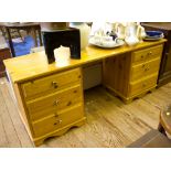 A pine dressing table, the kneehole flanked by three drawers on either side on bracket feet, 153cm