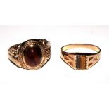 Two 9 carat gold rings set with tigers eye