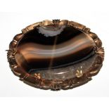 An attractive old agate (possibly blue John) oval brooch mounted in yellow metal