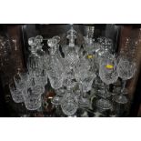 Five cut glass decanters and stoppers, a vinaigrette ewer and various cut glass drinking glasses