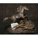 Bronze study of a wild stallion being chased by wolves