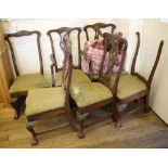 A set of seven George III style mahogany dining chairs, including a carver, possibly continental,