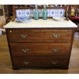 An Edwardian walnut chest of drawers, with marble washstand top, the tiled gallery over three long