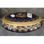 A Limoges underglaze blue oval box and lid, with gilt decoration