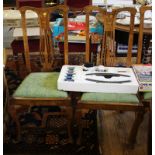 A set of four Edwardian stained beech dining chairs, the vase shape splats with foliate mother of