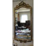 A giltwood wall mirror, with ribbon garland frame, 87cmx 39cm and an onyx hall table, with column