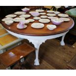 A mahogany and painted large centre table, the circular top on acanthus carved cabriole legs with