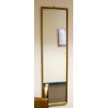 A giltwood full length wall mirror with foliate frame, 122cm x 33cm