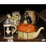 A Beswick relief jug depicting Hamlet, 20cm high, other novelty jugs and teapots, German pipes