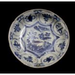 Wanli Shipwreck: A Chinese blue and white kraak dish, floral panels depicting a bird on a rock, 15cm