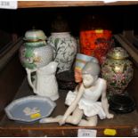 A Nao figure of a seated ballerina, two enamel vases and covers and various other ornaments