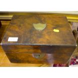 A Victorian walnut sewing box with brass shield shape plaque, 30cm diameter