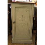 A mahogany and painted wood bedside cupboard, with floral carved panelled door, 39cm wide