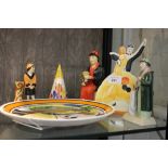 Three Manor limited edition Clarice Cliff centenary figurines, a Clarice Cliff style sugar sifter, a