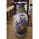A large Chinese form ornamental vase, with French style blue and white decoration framing prints