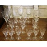 A set of six wheatsheaf cut wine glasses, with spiral stems, five matching sherry glasses and six